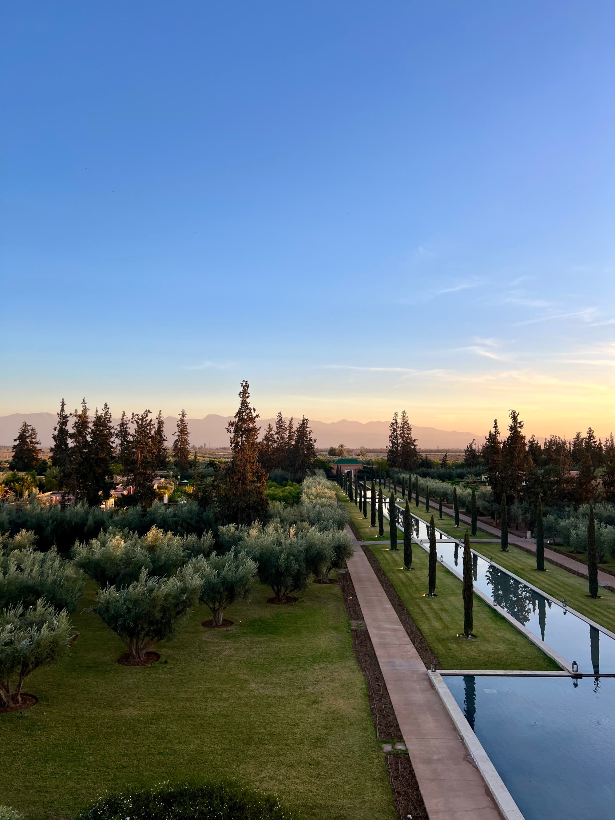 A lawn next to a stream of water during the sunset in Morocco in January