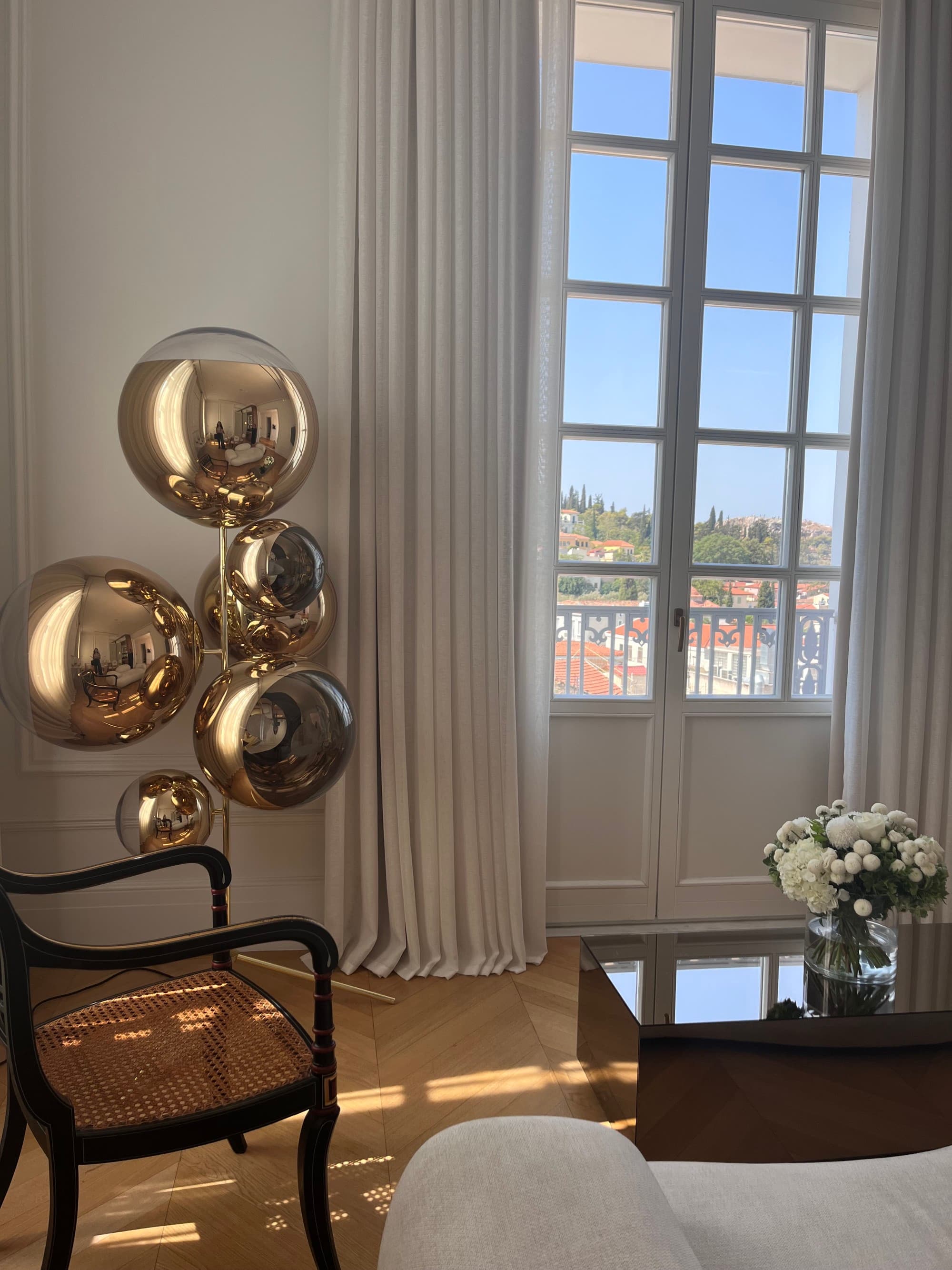 Window view overlooking the city on a sunny day.