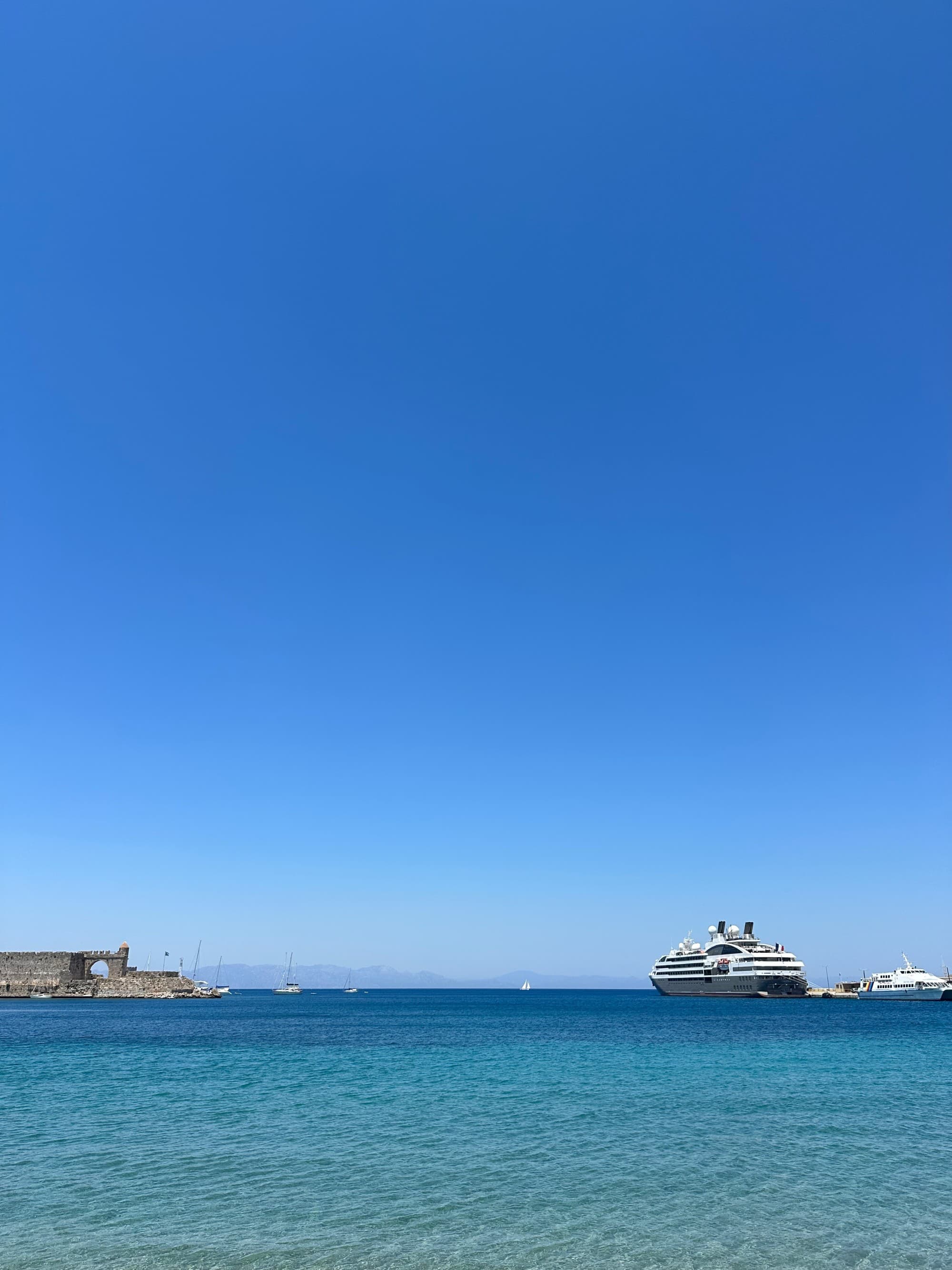 The ship in port on a pristine blue day in Rhodes - Kristyne Wada