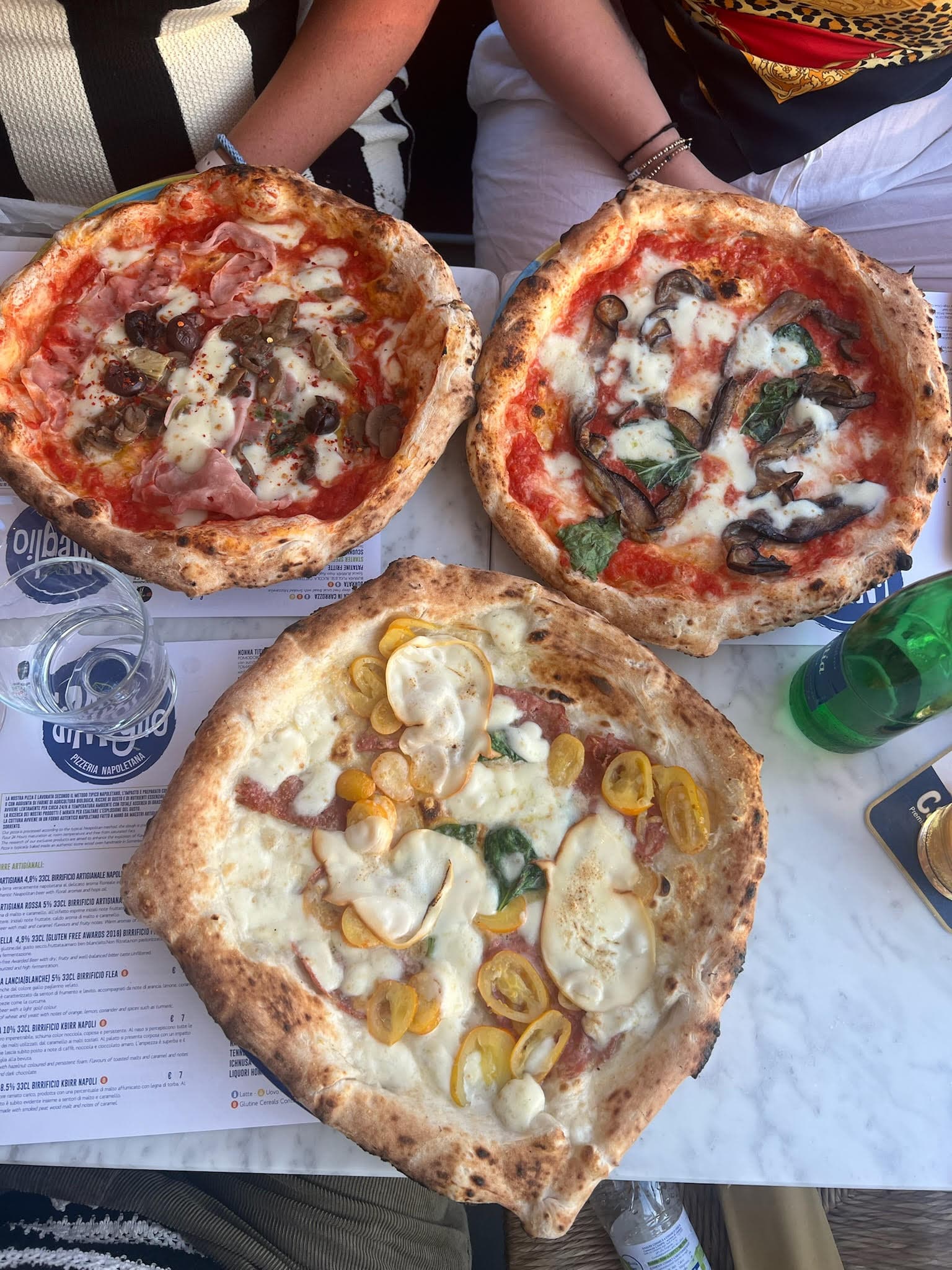 Pizza in various flavors at restaurant.