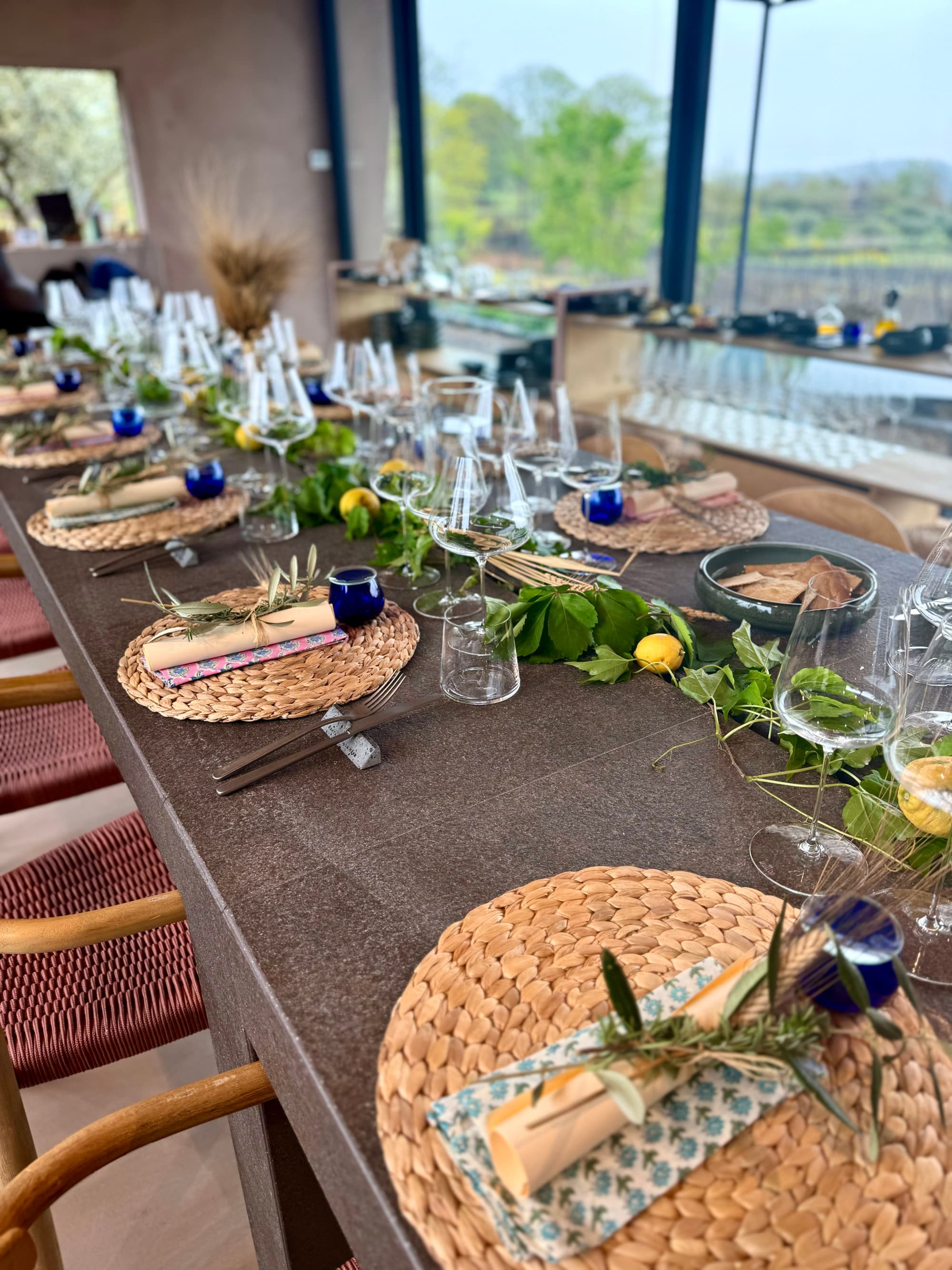 Table setup at Santa Maria LaNave with a beautiful wreath centerpiece and woven placemats