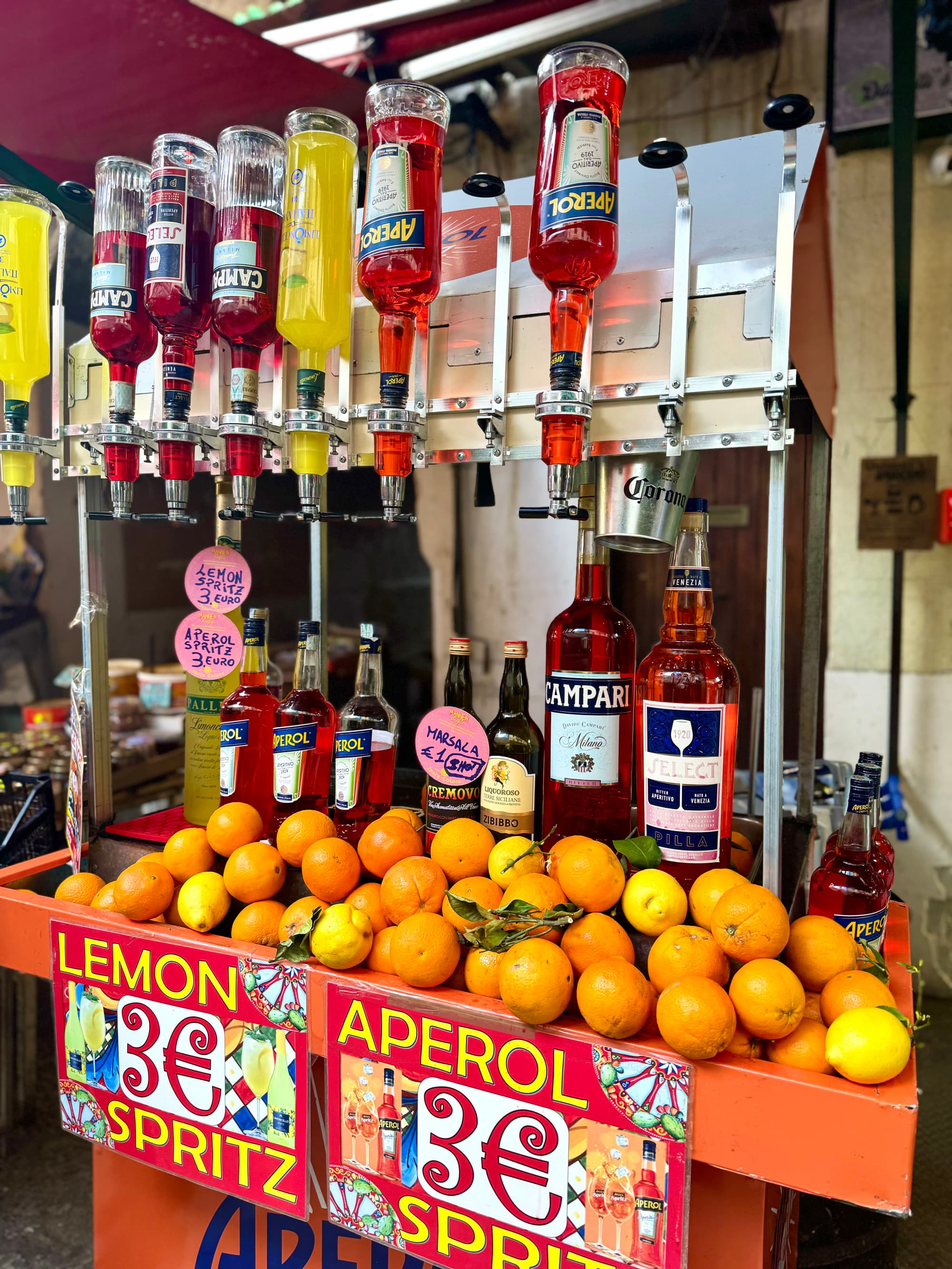 An Aperol Spritz stall with oranges and Aerpol bottles hanging