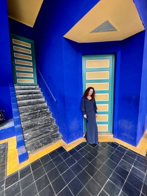 Woman posing in front of a door