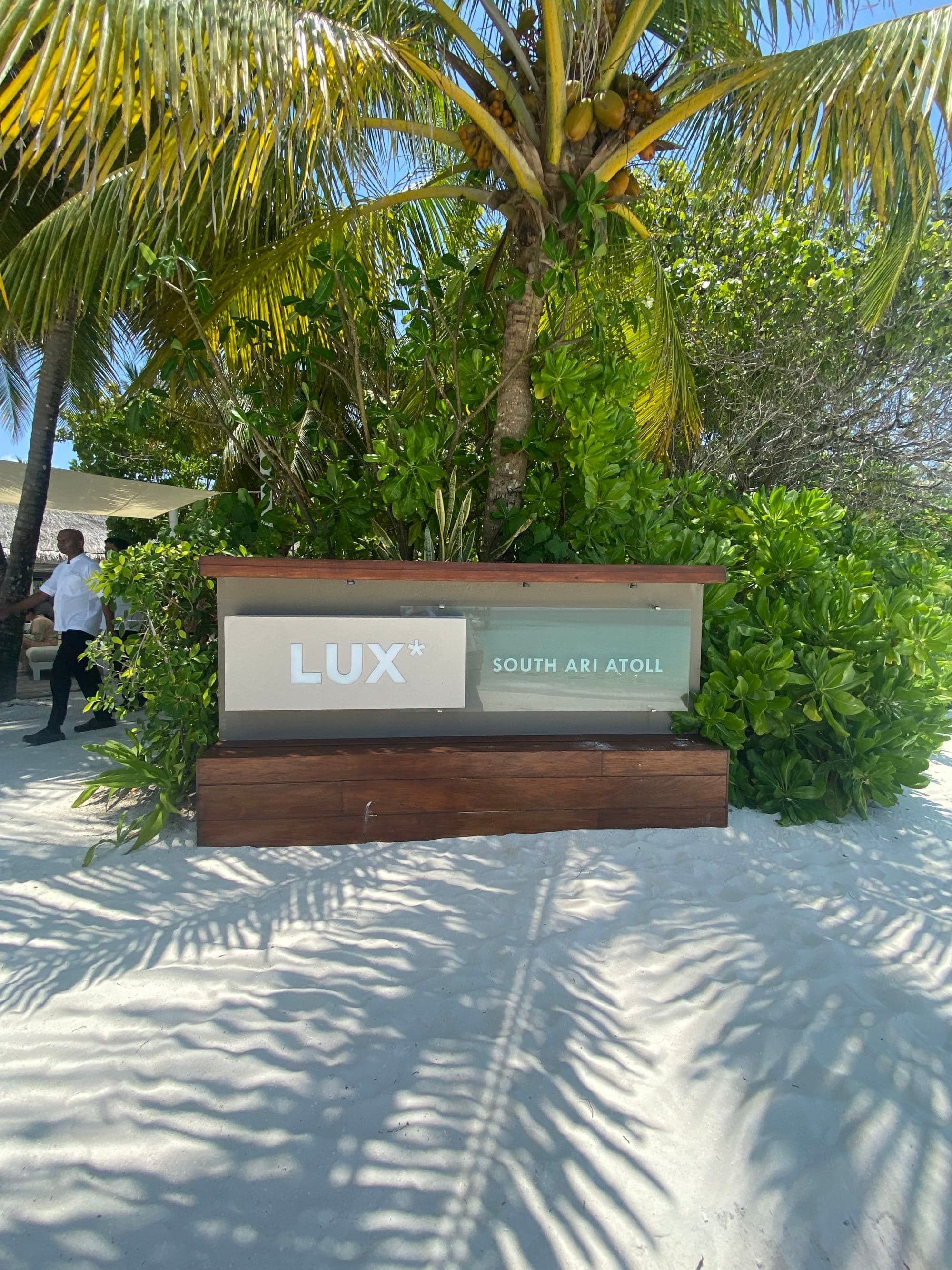 beachside view resort entrance board