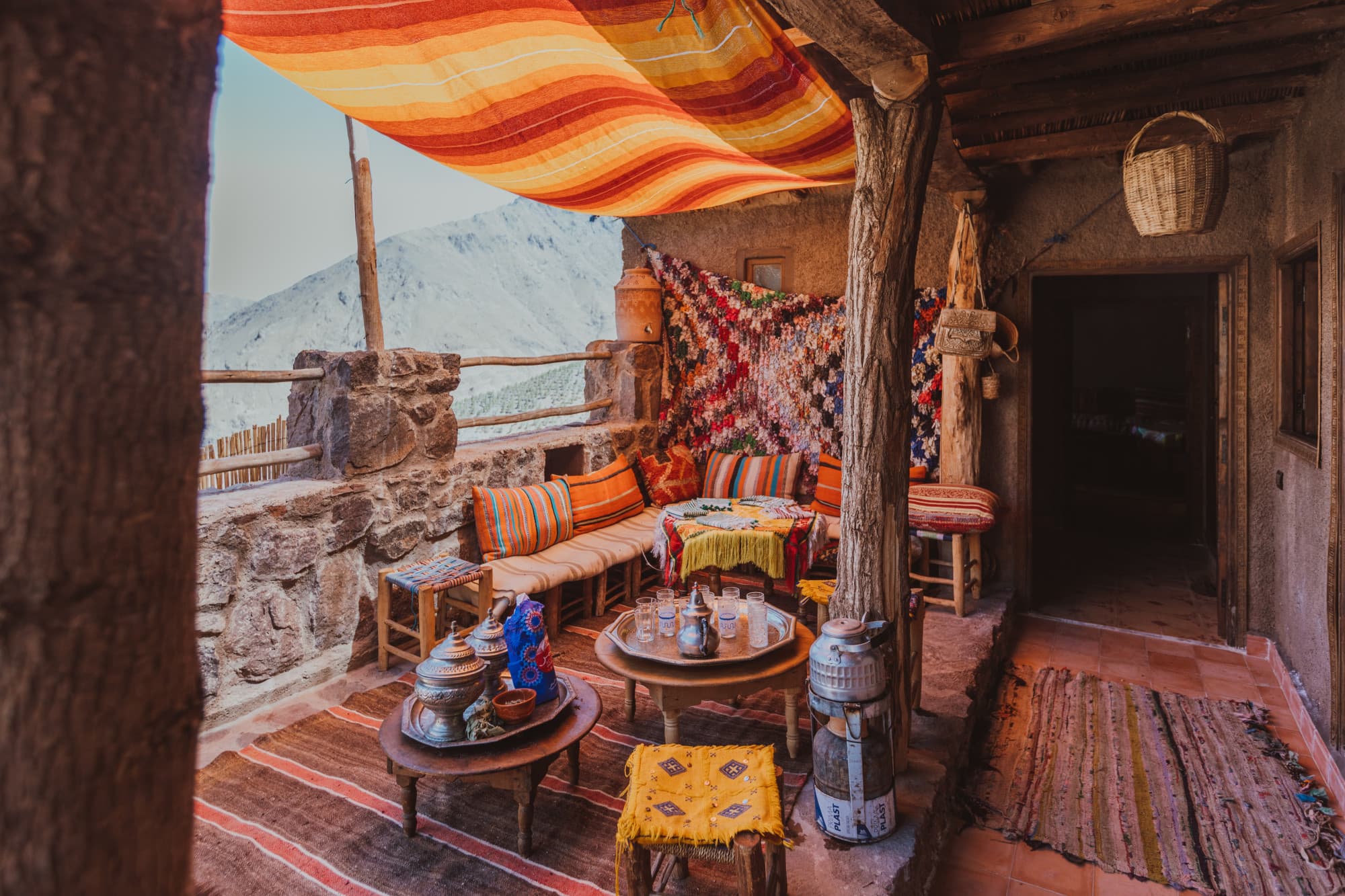 a colorful patio with brightly colored pillows