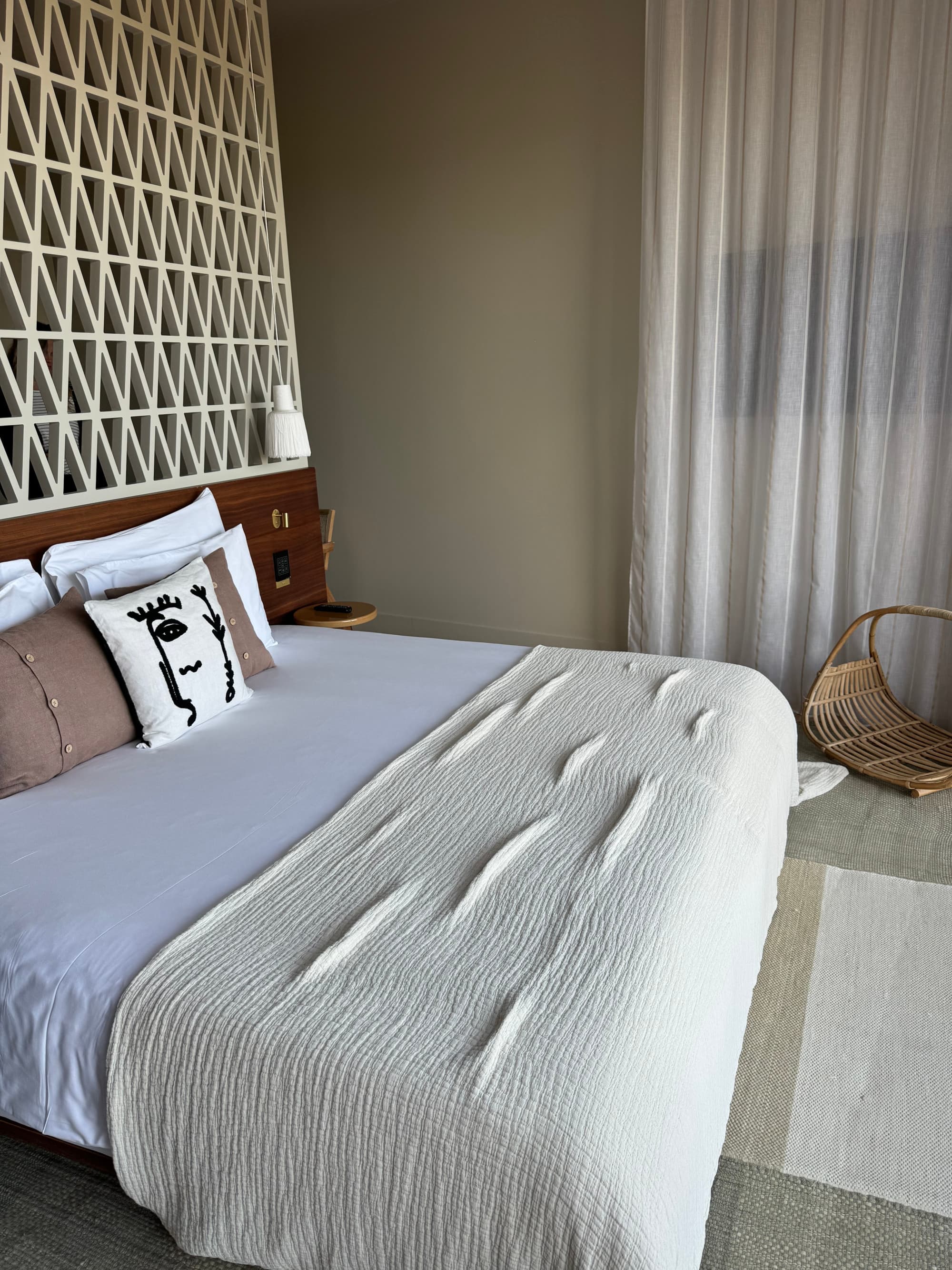 View of a room option with a large bed and modern amenities.