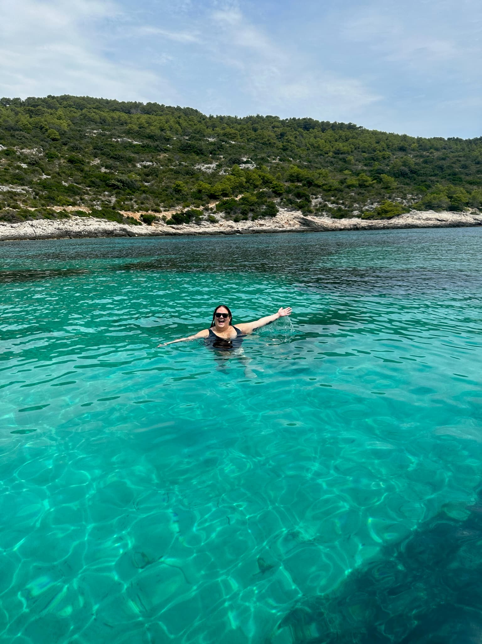 A lady swimming in a lake