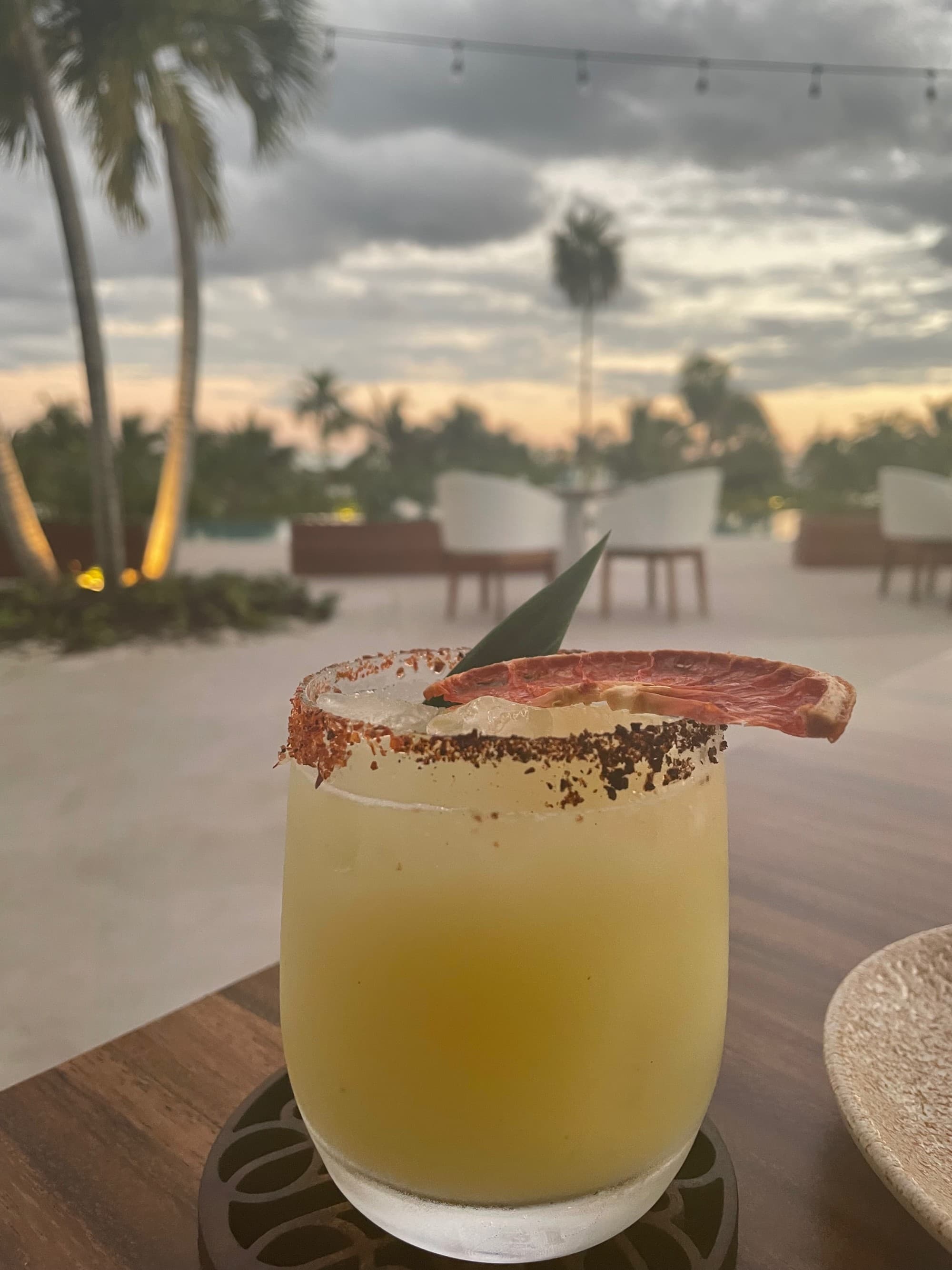 Yellow cocktail on the beach.