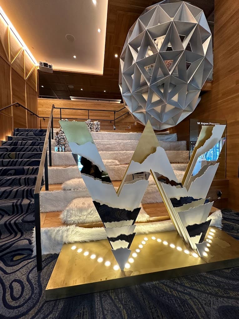 W Hotel lobby in Aspen has a rich carpet and large hotel logo display.