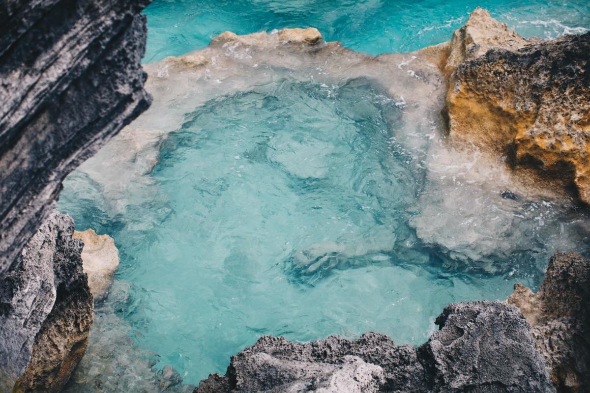 Clear water in shallow lagoon by sandstone in Bermuda.