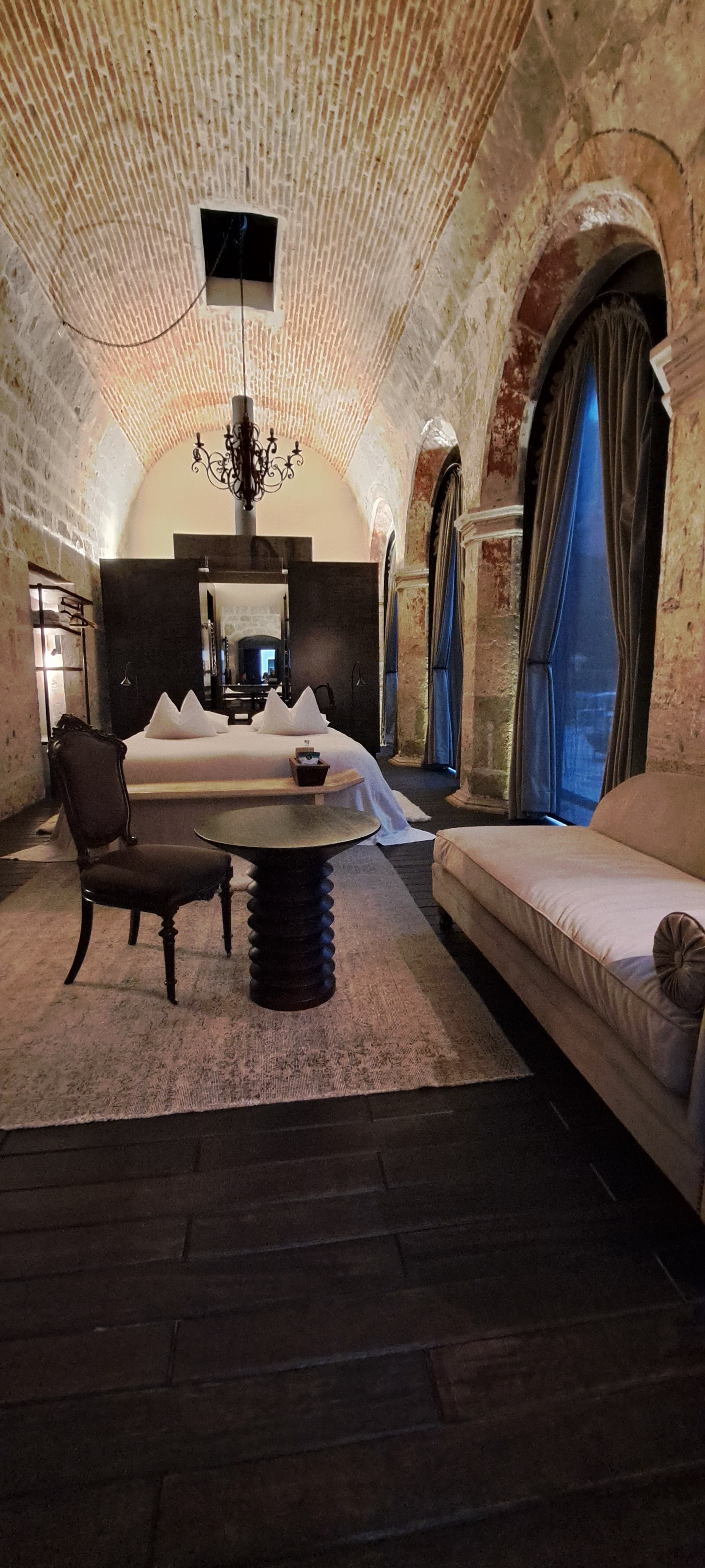 Hotel room with a vaulted ceiling.